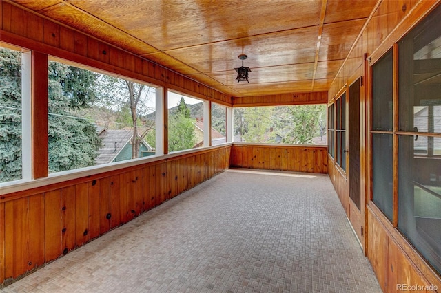 114 Cave Ave, Manitou Springs, CO 80829 - unfurnished sunroom featuring wooden walls, wood ceiling, and healthy amount of natural light