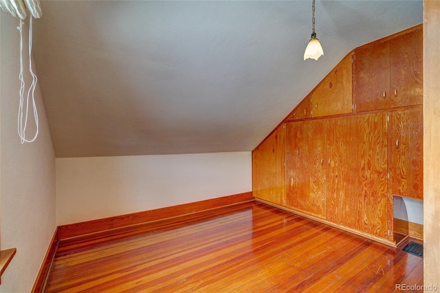 114 Cave Ave, Manitou Springs, CO 80829 - additional living space featuring vaulted ceiling, wood-type flooring, and baseboards