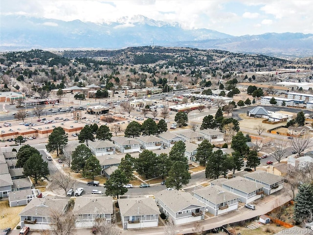 drone / aerial view featuring a residential view and a mountain view