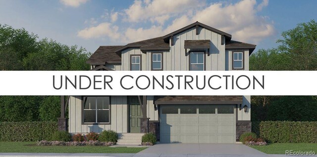 9900 Owl Perch Loop, Colorado Springs, CO 80908 - view of front of property featuring board and batten siding, a garage, driveway, and a shingled roof