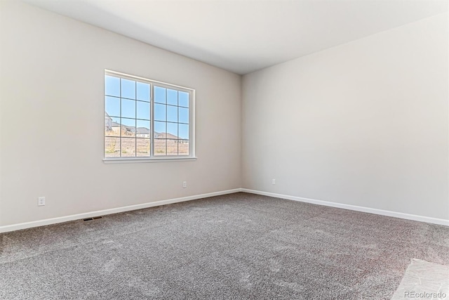 empty room featuring carpet floors