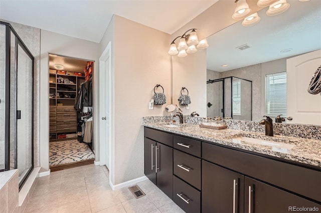 26731 E Hinsdale Pl, Aurora, CO 80016 - full bathroom with a sink, a stall shower, double vanity, and visible vents
