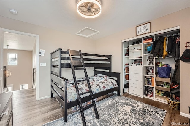 26731 E Hinsdale Pl, Aurora, CO 80016 - bedroom featuring baseboards, wood finished floors, attic access, and a closet