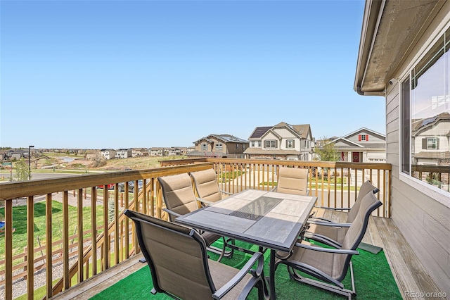 26731 E Hinsdale Pl, Aurora, CO 80016 - wooden terrace featuring outdoor dining area and a residential view