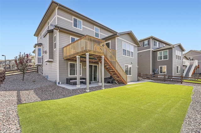 26731 E Hinsdale Pl, Aurora, CO 80016 - back of property with stairs, a deck, a fenced backyard, a patio, and a yard