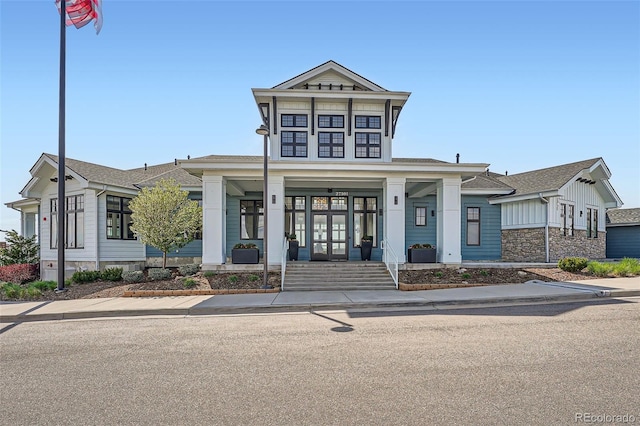 26731 E Hinsdale Pl, Aurora, CO 80016 - view of front of property featuring a porch, french doors, a shingled roof, and stone siding