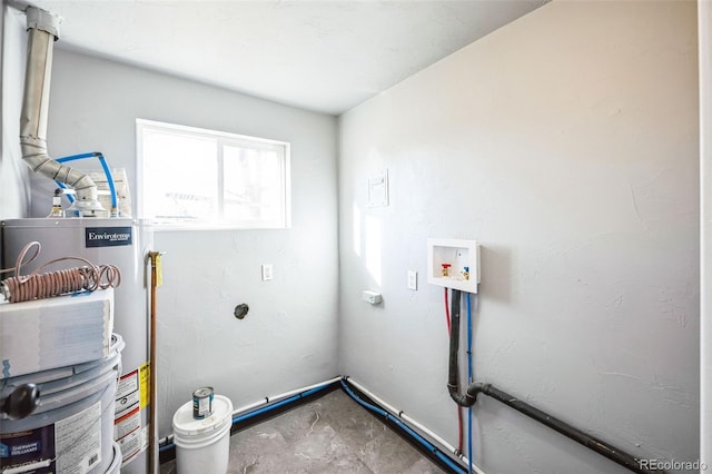 washroom featuring laundry area, water heater, and hookup for a washing machine