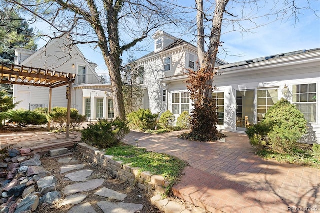 view of front of house with a pergola