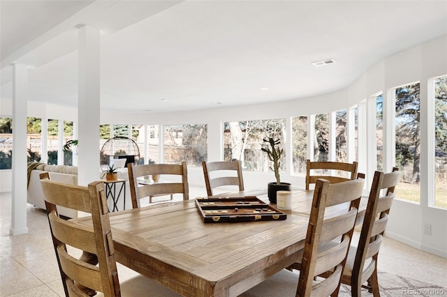 dining area featuring visible vents and baseboards