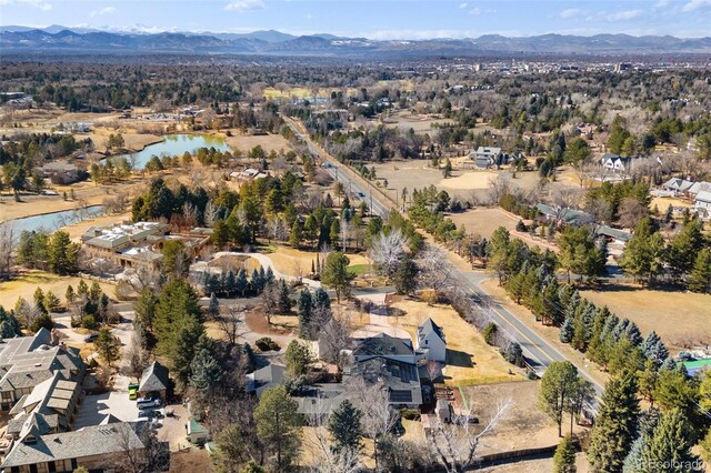 drone / aerial view with a water and mountain view