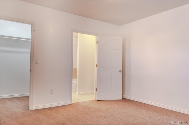 4368 Benton St, Denver, CO 80212 - unfurnished bedroom with carpet floors, a walk in closet, a closet, and ensuite bathroom