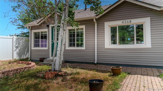 4368 Benton St, Denver, CO 80212 - view of front of property featuring roof with shingles and entry steps