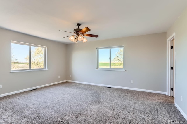 31142 County Road 18, Keenesburg, CO 80643 - spare room featuring carpet flooring, baseboards, a ceiling fan, and visible vents