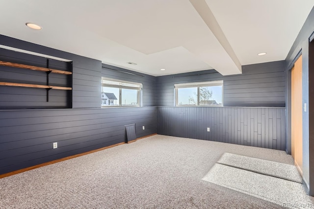 31142 County Road 18, Keenesburg, CO 80643 - spare room featuring wood walls, carpet flooring, and recessed lighting