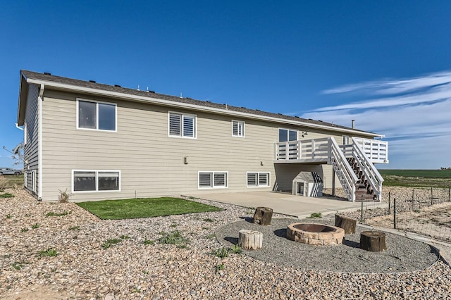 31142 County Road 18, Keenesburg, CO 80643 - rear view of property with a fire pit, a patio, stairway, and a wooden deck