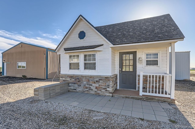 31142 County Road 18, Keenesburg, CO 80643 - view of front of home featuring stone siding and roof with shingles