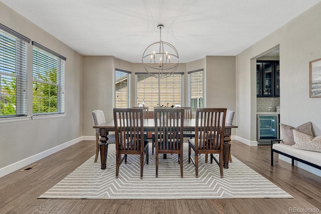 6738 Esmeralda Dr, Castle Rock, CO 80108 - dining room featuring a chandelier, healthy amount of natural light, baseboards, and beverage cooler