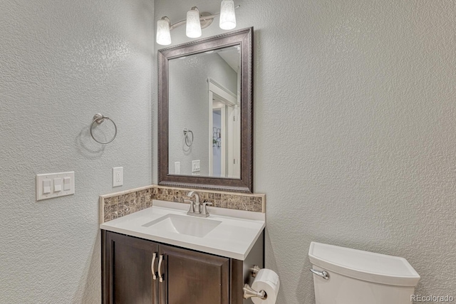 6738 Esmeralda Dr, Castle Rock, CO 80108 - bathroom with vanity, toilet, and a textured wall