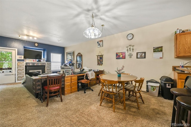 5720 County Road 64 # A102, Bailey, CO 80421 - dining room with light colored carpet and a fireplace