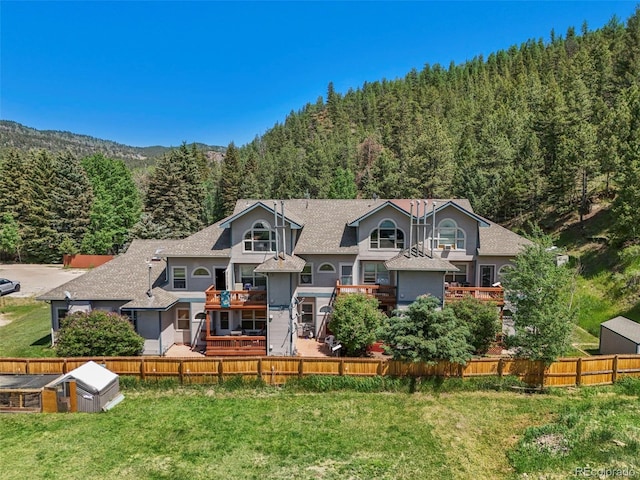 5720 County Road 64 # A102, Bailey, CO 80421 - view of front of property with a view of trees and roof with shingles