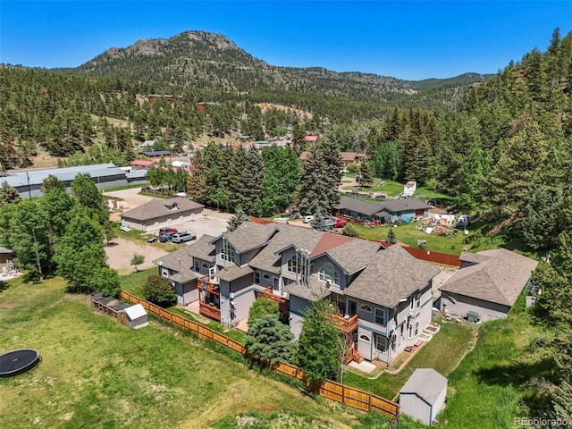 5720 County Road 64 # A102, Bailey, CO 80421 - aerial view of residential area with a mountain backdrop and a heavily wooded area