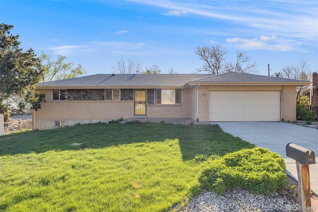 772 Urban Ct, Lakewood, CO 80401 - single story home featuring concrete driveway, brick siding, an attached garage, and a front yard