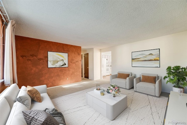 772 Urban Ct, Lakewood, CO 80401 - living area featuring light carpet, a textured ceiling, an accent wall, baseboards, and wallpapered walls