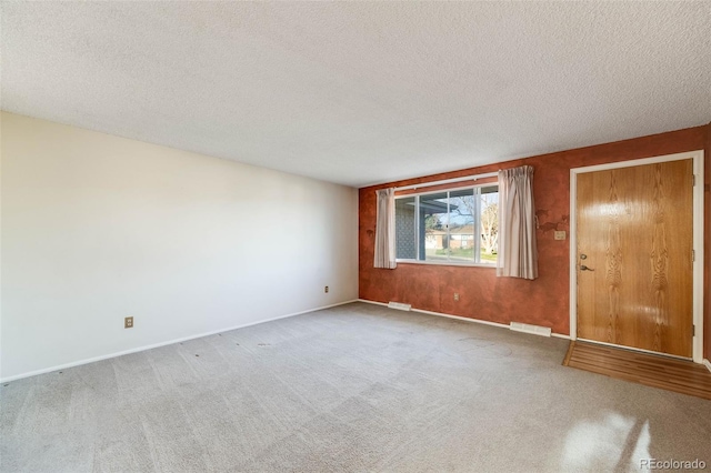 772 Urban Ct, Lakewood, CO 80401 - carpeted spare room with a textured ceiling, visible vents, and baseboards