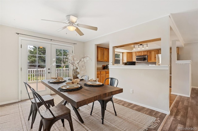4451 Ranch Cir, Colorado Springs, CO 80918 - dining area featuring light wood finished floors, french doors, ceiling fan, and track lighting