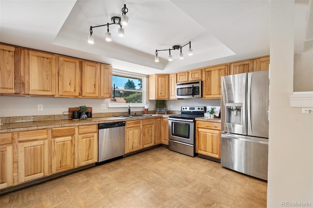 4451 Ranch Cir, Colorado Springs, CO 80918 - kitchen with appliances with stainless steel finishes, a raised ceiling, light flooring, and tile countertops