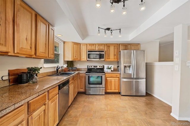 4451 Ranch Cir, Colorado Springs, CO 80918 - kitchen featuring stainless steel appliances, a raised ceiling, and tile countertops