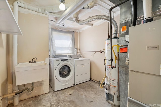 4451 Ranch Cir, Colorado Springs, CO 80918 - washroom with gas water heater, separate washer and dryer, and heating unit