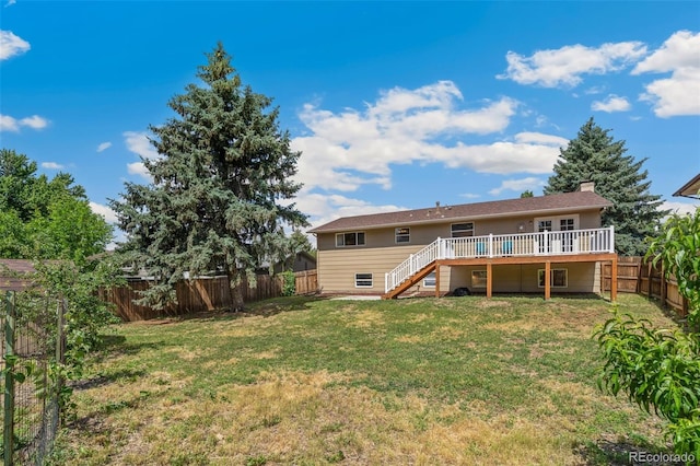4451 Ranch Cir, Colorado Springs, CO 80918 - rear view of house with stairway, a deck, and a fenced backyard