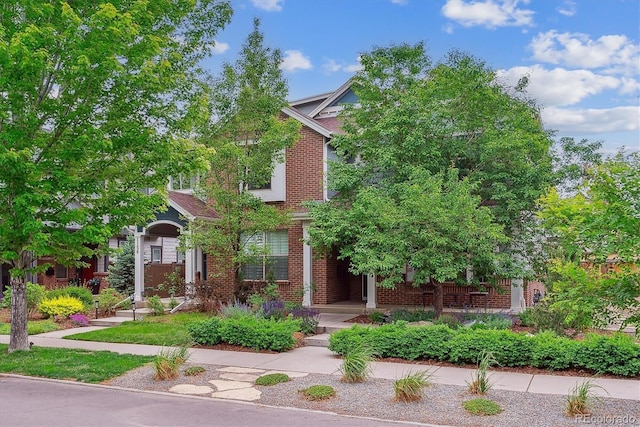 1160 S Sherman St, Denver, CO 80210 - view of property hidden behind natural elements with brick siding