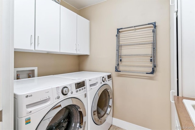 1160 S Sherman St, Denver, CO 80210 - laundry room with separate washer and dryer, cabinet space, and baseboards