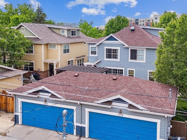 1160 S Sherman St, Denver, CO 80210 - view of front of house featuring a shingled roof and a garage