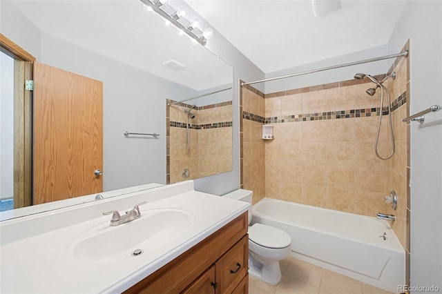 full bathroom with tile patterned flooring, vanity, toilet, and tiled shower / bath