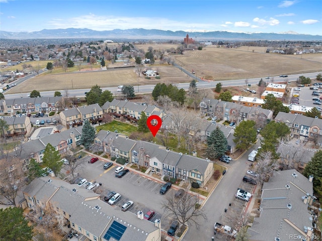 birds eye view of property featuring a mountain view