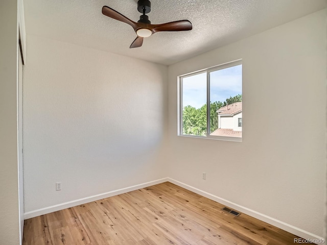 21472 E 46th Ave, Denver, CO 80249 - empty room featuring baseboards, light wood-style floors, ceiling fan, and a textured ceiling