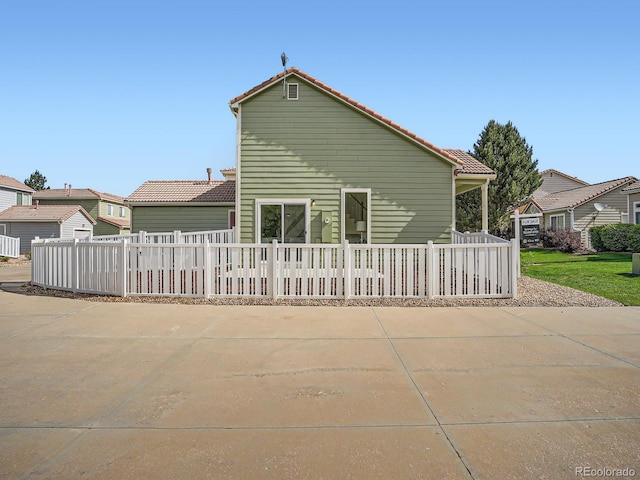 21472 E 46th Ave, Denver, CO 80249 - rear view of property with a tiled roof