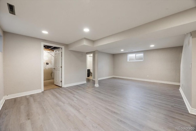 2121 Carmel Dr, Colorado Springs, CO 80910 - below grade area featuring visible vents, baseboards, recessed lighting, and wood finished floors