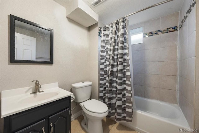 2121 Carmel Dr, Colorado Springs, CO 80910 - full bath with vanity, shower / bath combo, tile patterned floors, toilet, and visible vents