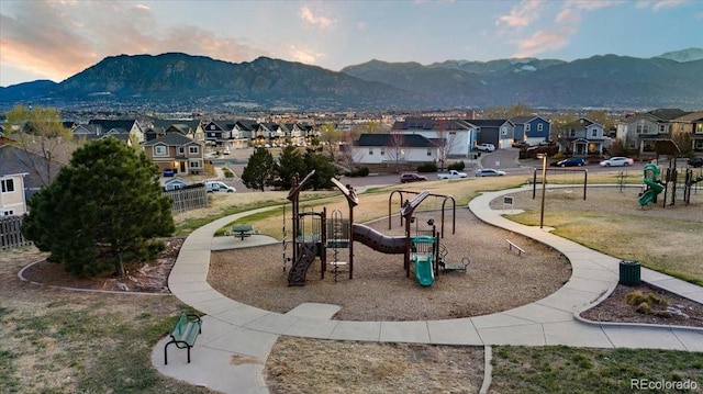 2121 Carmel Dr, Colorado Springs, CO 80910 - view of home's community featuring fence, a mountain view, playground community, and a residential view