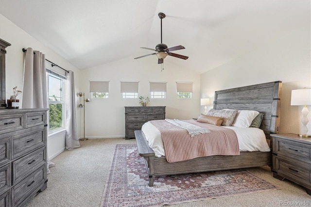 bedroom with baseboards, a ceiling fan, lofted ceiling, and light colored carpet