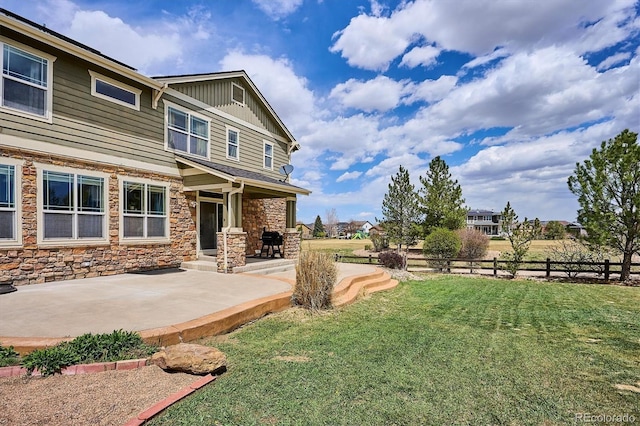 view of yard with fence and a patio area