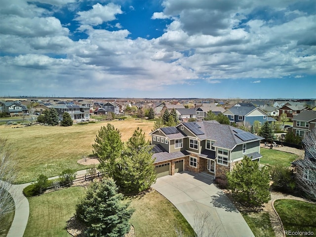 birds eye view of property with a residential view