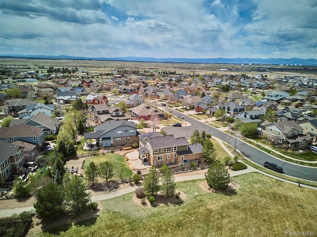 drone / aerial view featuring a residential view and a mountain view