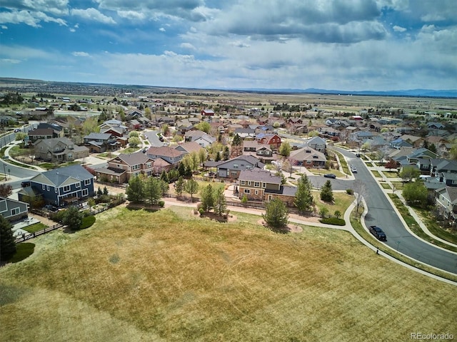 birds eye view of property with a residential view