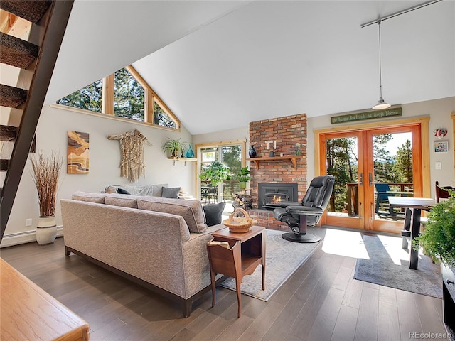 living area with french doors, dark wood-type flooring, and a healthy amount of sunlight