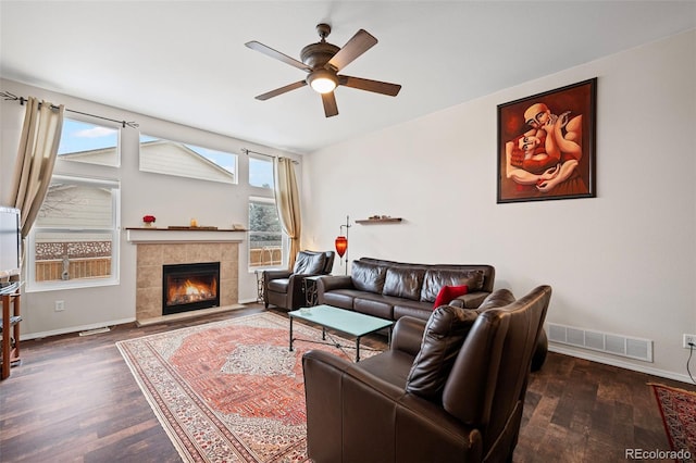 6615 Annanhill Pl, Colorado Springs, CO 80922 - living area featuring a ceiling fan, wood finished floors, and a fireplace